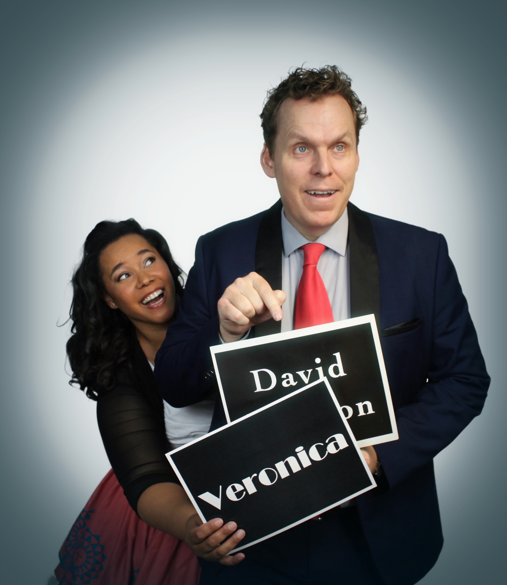 Dave and Veronica playfully swapping name cards